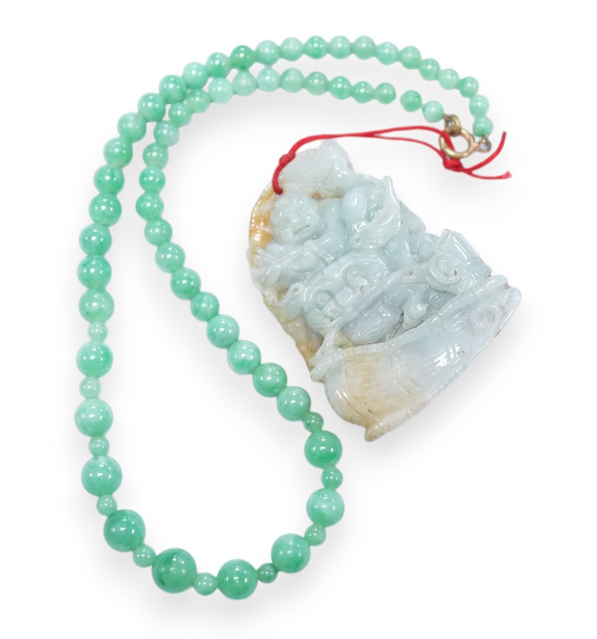 A Chinese jadeite carving and jadeite bead necklace, carving 6.5cm long. Condition - good